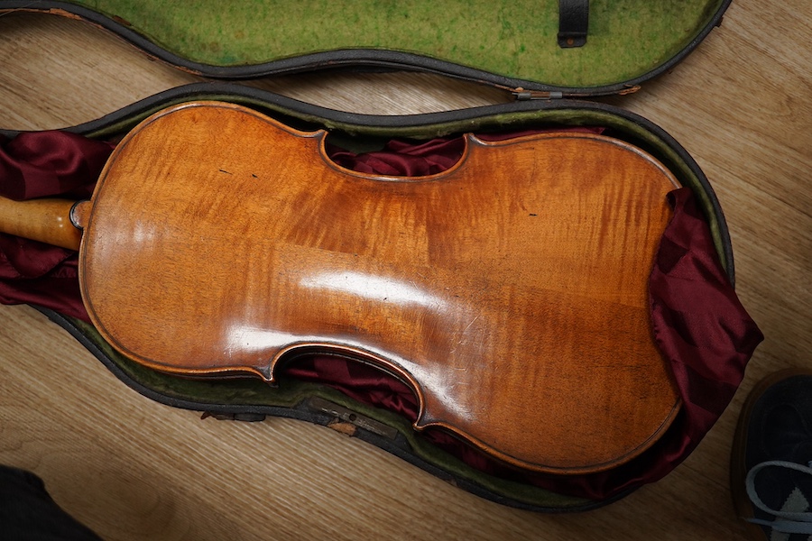 A late 19th century German violin from the Mittenwald region, body length 36cm, in a contemporary case. Condition - fair to good, condition of the case - poor.